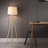 White Cylindrical Wooden Tripod Floor Lamp